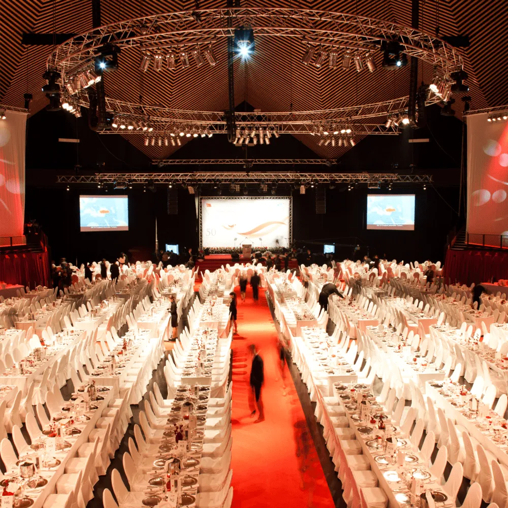 Festively set gala hall with a red carpet